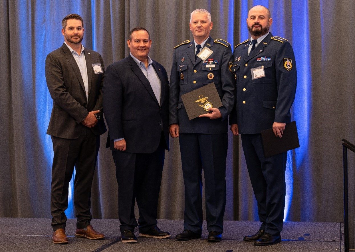 Major Ferdinand Halasz (second from right) received the Maintenance Award and Colonel Tomas Pavlik (right) accepted a 1,000 Hour Flight Award on behalf of Colonel Stefan Okos. Photo courtesy, Sikorsky, a Lockheed Martin company.